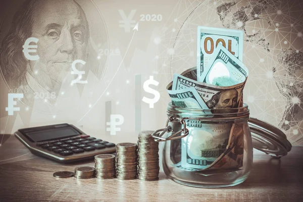 Coins Stack, calculator, dollar bills in glass jar, virtual hologram, earth, stat, graph,currency icons different countries. Savings money,income Investment ideas, management.Business Growth concept