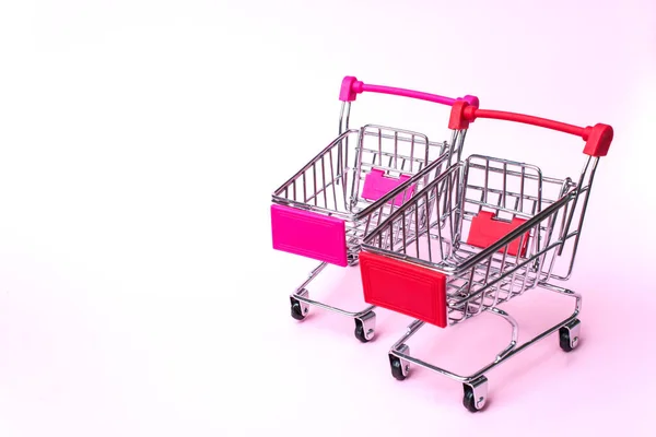 Winkelwagentjes Van Supermarkt Roze Achtergrond Winkelen Winkelcentrum Business Concept — Stockfoto