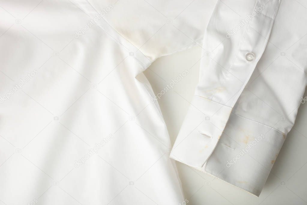 Dirty white shirt. Concept stain remover.