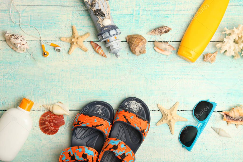 Collage of children beach accessories on wooden background. Concept summer vacation. Top view.