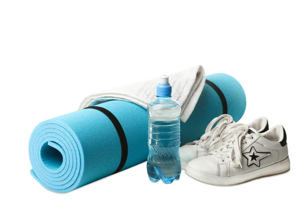 Sneakers, water and gymnastic carpet isolated on white. Concept sport.