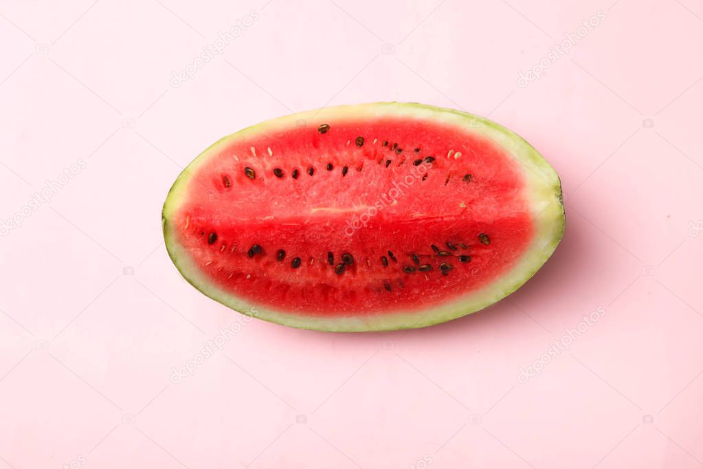 Slice fresh watermelon on pink background. Top view.