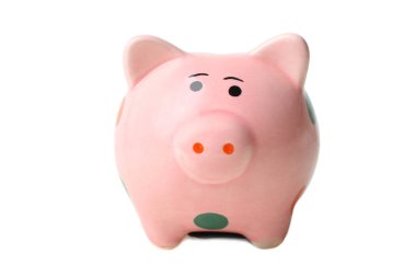 Polka dot beyaz izole bir pembe pig piggy banka. Kavram tasarruf.