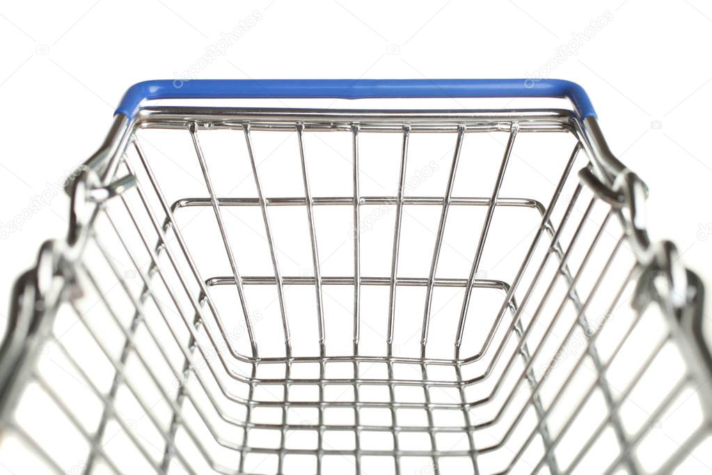 Grocery trolly or metal shopping basket isolated on white. Concept shopping in supermarket.