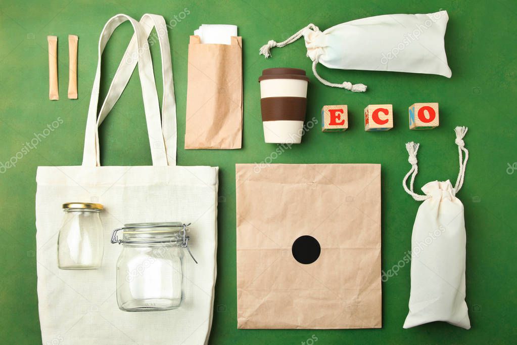 Reusable bamboo glass, eco bag and other various recyclable, environmentally friendly materials. Flat lay.