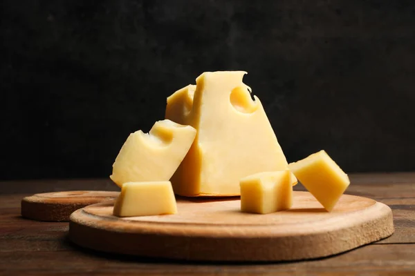 Hard Sliced Yellow Maasdam Cheese Wooden Cutting Board Table Black — Stock Photo, Image