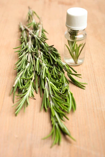 Fresh Green Rosemary Branch Aroma Oil Bottle Wooden Background Concept — Stock Photo, Image