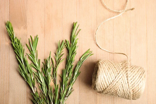 Fresh Green Rosemary Branch Twine Wooden Background Top View — Stock Photo, Image