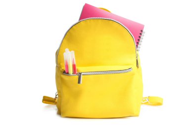 yellow backpack with different school supplies clipart