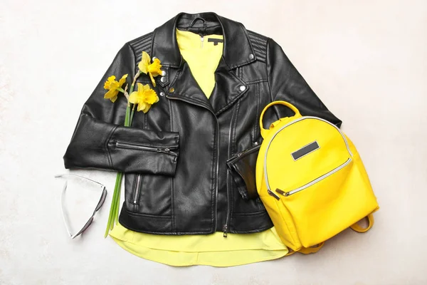 spring clothes and   yellow backpack