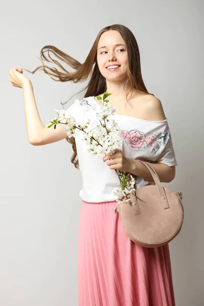 girl in stylish spring clothes with fashionable round handbag