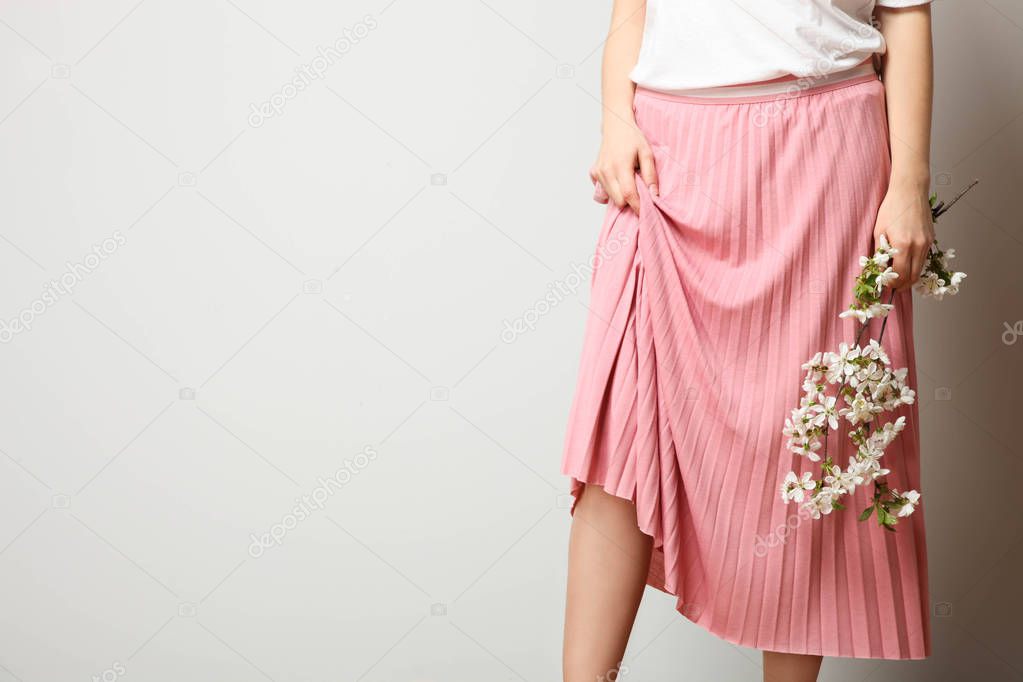 Girl in stylish fashionable pink skirt
