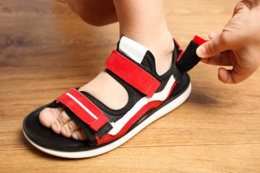 Stylish red sandals with velcro clipart