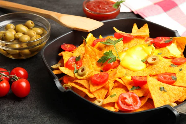 Cooking of crispy corn chips nachos with vegetables — Stock Photo, Image