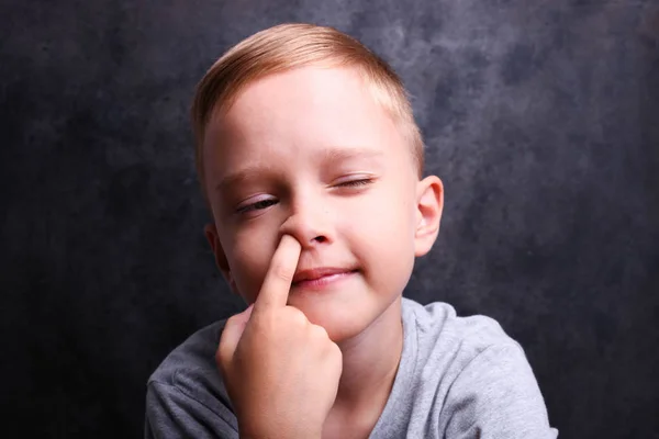 Boy picking his nose — Stock Photo, Image