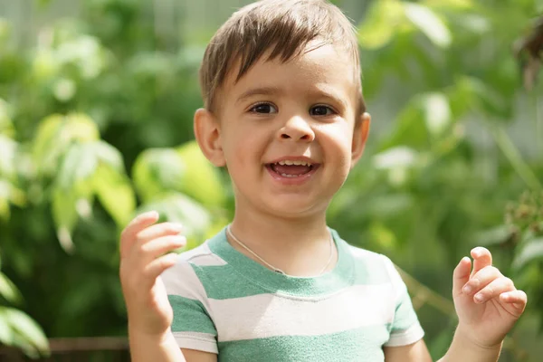 Summer, vacation, childhood, communication concepts. happy little surprised boy Persian appearance of eastern nationality is outside. Bright look of cute little boy aged 2 years. Close-up view of — Stock Photo, Image