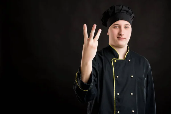 Retrato Jovem Sexo Masculino Vestido Com Terno Chef Preto Contando — Fotografia de Stock