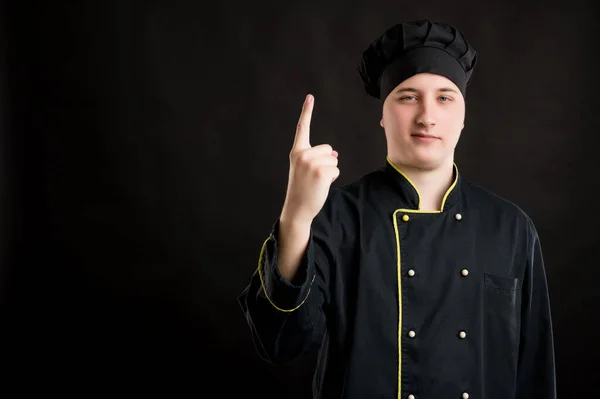 Porträtt Ung Man Klädd Svart Kock Kostym Räkna Med Fingret — Stockfoto