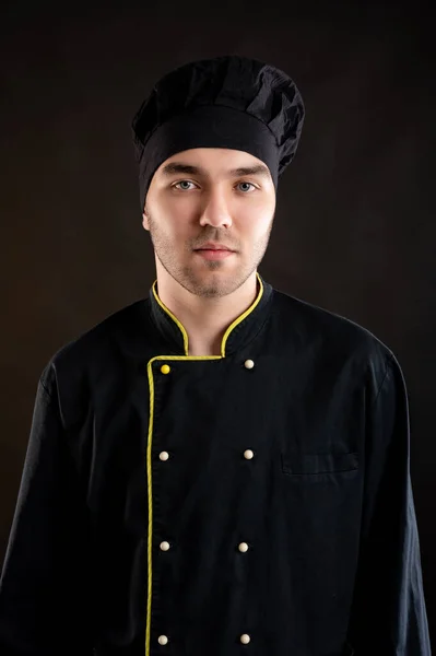Retrato Joven Vestido Con Traje Chef Negro Posando Sobre Fondo —  Fotos de Stock