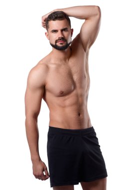 Izole arka plan üzerinde Yakışıklı kaslı adam vücudunu gösterir. Sporcuların bedeni. Spor konsepti