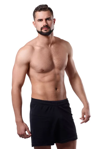 Izole arka plan üzerinde Yakışıklı kaslı adam vücudunu gösterir. Sporcuların bedeni. Spor konsepti