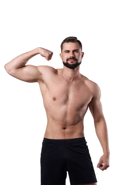 El musculoso muestra su brazo. Deportista con cuerpo plano sobre fondo aislado. Concepto deportivo —  Fotos de Stock