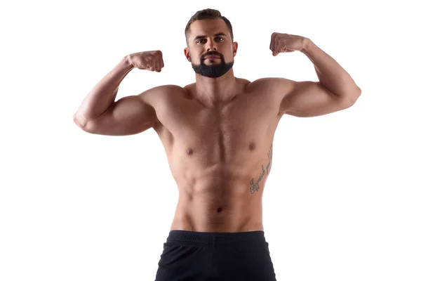 Schöner muskulöser Mann auf isoliertem Hintergrund zeigt seinen Körper. Sportlerkörper. Sportkonzept — Stockfoto