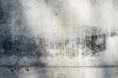 Gri beton yüzey, eklem çizgisi ve zengin dokusu var..