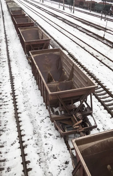 Empty freight wagons on the railroad in winter