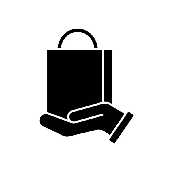 Ruka drží ikonu nákupní tašky, silueta styl — Stockový vektor