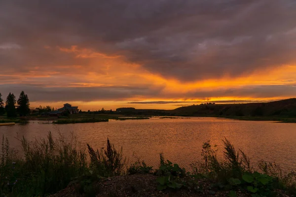 Sunset over a small lake in summer in Bashkiria — Stock Photo, Image