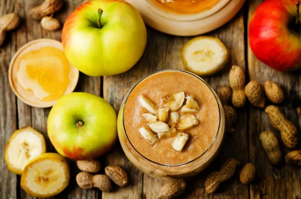 peanut butter smoothie with milk, chocolate, apples, banana and oats. the toning. selective focus