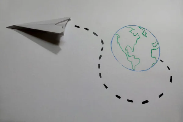 Planet Earth Drawn Green Blue Crayons Paper Plane Points Its — Stock Photo, Image
