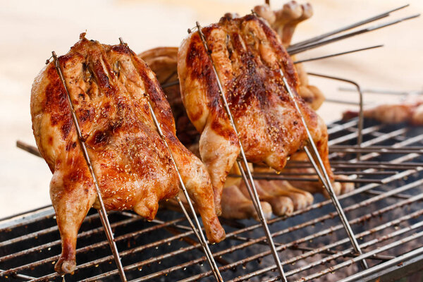 Roasted chicken on barbecue grills