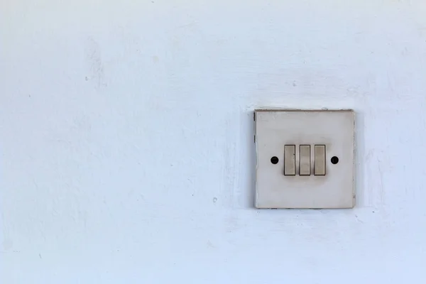 Old Switch on white  cement wall — Stock Photo, Image