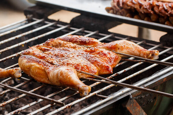 Roasted chicken on barbecue grills