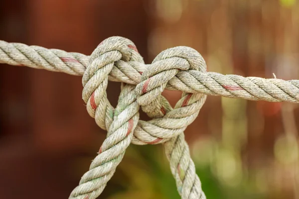 Old fishing boat rope with a Tied Knot — Stock Photo, Image