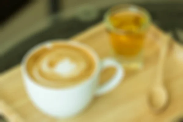 Tasse Cappuccino mit Schaum verschwommenem Hintergrund — Stockfoto