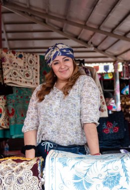 Portrait of beautiful Young woman from Kazakhstan in traditional dress participating in Surajkund Craft Fair, Faridabad, Haryana, India, February 2020 clipart
