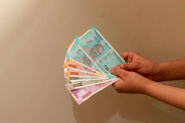 stock image Crop view of Young boy hand keeping New Indian Currency