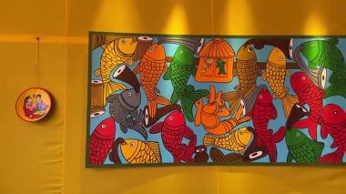 New Delhi, India - October 09 2024: Handmade colorful decorations at the canvas on plain wall. Interior decoration concept.