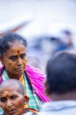 Varanasi, Uttar Pradesh, India - March 21 2024: Portrait of an unidentified holy brahmin in traditional dress at the ghats near ganges in varanasi during winter morning.