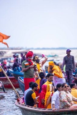 Varanasi, Uttar Pradesh, India - March 21, 2024: Masan Holi, Masan Holi, Group of unidentified devotees participating in masan holi festival at manikarnika ghat of varanasi with colours.