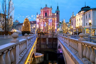 Triple bridges, Christmas tree on Preseren's square and Franciscan church, illuminated for Christmas and New Year's celebration, Ljubljana, Slovenia clipart