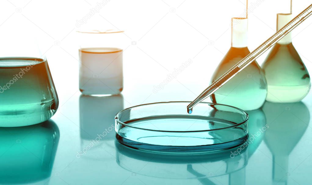Laboratoy glassware with chemicals and liquids, chemistry science