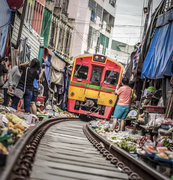 Maeklong Railway Market, a local market commonly called Siang Tai (life-risking) Market. It is considered one of amazing-Thailand attractions. Spreading over a 100-metre length, the market is located by the railway near Mae Klong Railway Statio