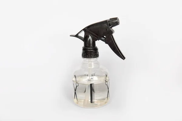 Hairdresser plastic water sprayer container on white background
