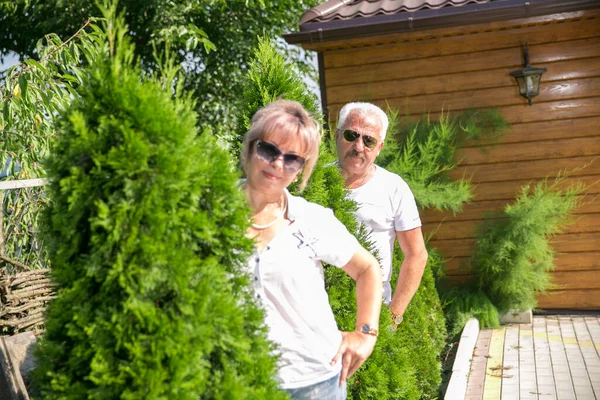 A middle-aged couple amid the green .