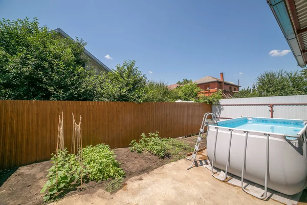 Swimming pool under construction. high pool. frame pool