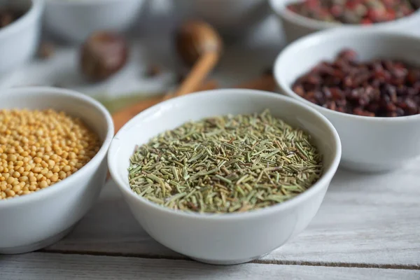 Dry seasonings and spices against a dark background view from the top.